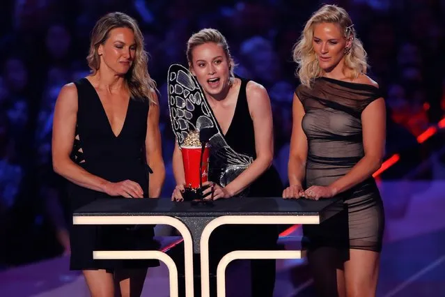 Captain Marvel actress Brie Larson and stunt doubles (L-R) Ingrid Kleinig and Joanna Bennett accept the Best Fight award for 'Captain Marvel' onstage during the 2019 MTV Movie and TV Awards at Barker Hangar on June 15, 2019 in Santa Monica, California. (Photo by Mike Blake/Reuters)