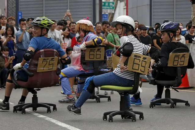 Competitors take part in the office chair race ISU-1 Grand Prix in Tainan, southern Taiwan April 24, 2016. (Photo by Tyrone Siu/Reuters)