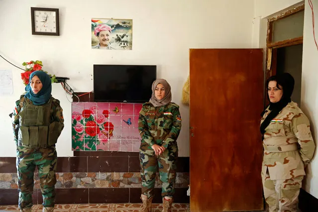 Female Peshmerga fighters stand at their site near the frontline of the fight against Islamic State militants in Nawaran near Mosul, Iraq, April 20, 2016. (Photo by Ahmed Jadallah/Reuters)