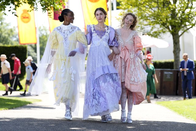 Models Kentha Kirezi (left), Meja Jurgelaityte and Lila Nova wearing Bora Aksu inspired by Goodwood during day one of the Qatar Goodwood Festival at the Goodwood Racecourse, Chichester, UK on Tuesday, July 30, 2024. (Photo by Andrew Matthews/PA Images via Getty Images)