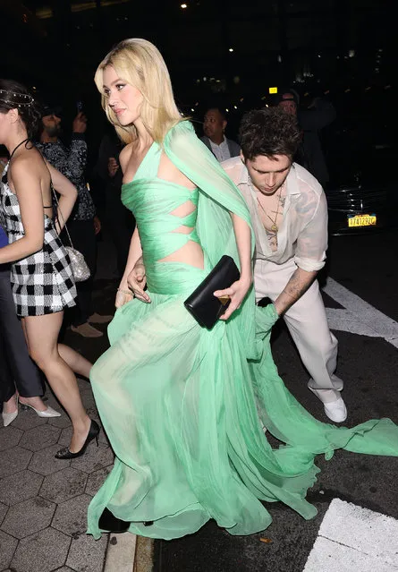 Brooklyn Beckham holds wife Nicola Peltz dress as they arrive to the Cipriani Met Gala after-party in New York City on May 2, 2022. (Photo by The Mega Agency)