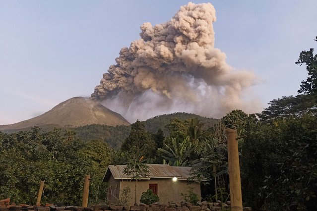 Mount Lewotobi Laki-laki spews volcanic ash during an eruption as seen from Dilipali village in East Flores, East Nusa Tenggara, on July 10, 2024. (Photo by Arnold Welianto/AFP Photo)