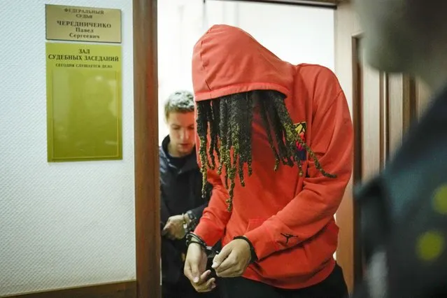 WNBA star and two-time Olympic gold medalist Brittney Griner leaves a courtroom after a hearing, in Khimki just outside Moscow, Russia, Friday, May 13, 2022. Griner, a two-time Olympic gold medalist, was detained at the Moscow airport in February after vape cartridges containing oil derived from cannabis were allegedly found in her luggage, which could carry a maximum penalty of 10 years in prison. (Photo by Alexander Zemlianichenko/AP Photo)