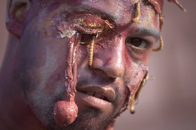 A participant of the “Zombie Takeover of Coney Island” poses for a portrait in Coney Island in the Brooklyn borough of New York, July 2, 2014. (Photo by Carlo Allegri/Reuters)