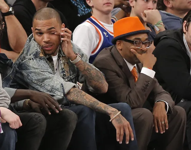 Chris Brown sitting next to Spike Lee as the Knicks play the Celtics at Madison Square Garden, March 2013. (Photo by Ray Stubblebine/Reuters)