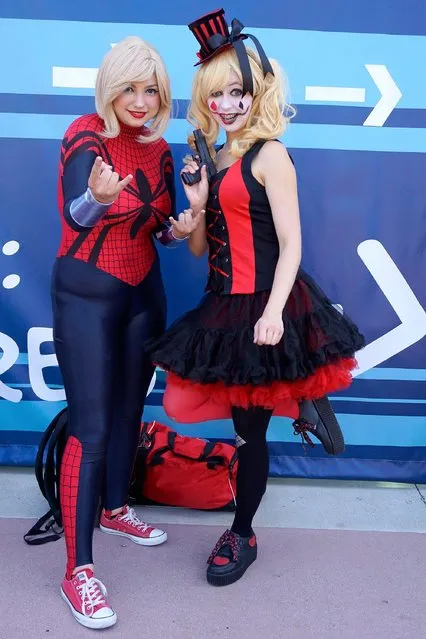 Cosplayers dressed as female Spider-man (L) and Harley Quinn pose for a photograph during Comic Con in San Diego, California, USA, 20 July 2017. (Photo by Nina Prommer/EPA)