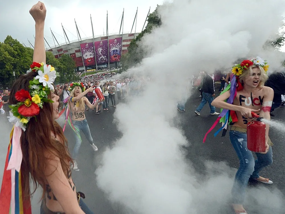 FEMEN Activists Strip In Protest Against EURO 2012