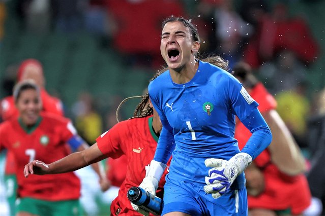 Morocco's goalkeeper #01 Khadija Er-Rmichi celebrates her team's victory and qualification to the knockout stage after the end of the Australia and New Zealand 2023 Women's World Cup Group H football match between Morocco and Colombia at Perth Rectangular Stadium in Perth on August 3, 2023. (Photo by Colin Murty/AFP Photo)