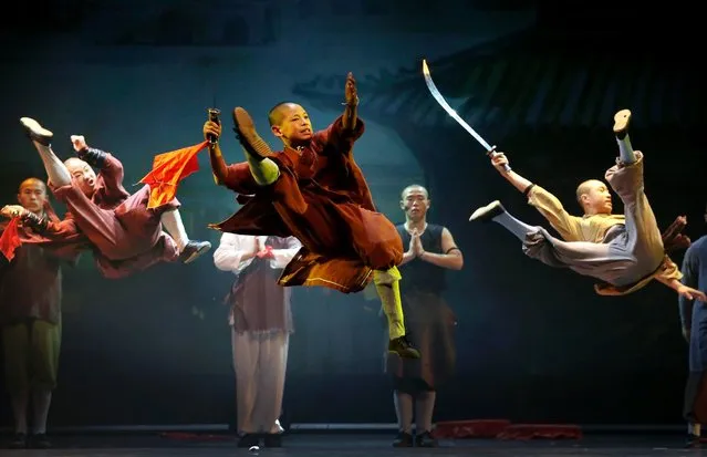 Shaolin monks, who are part of a 20-member cast, perform during a media preview of their new show “Shaolin”, July 13, 2016, in Singapore. (Photo by Wong Maye-E/AP Photo)