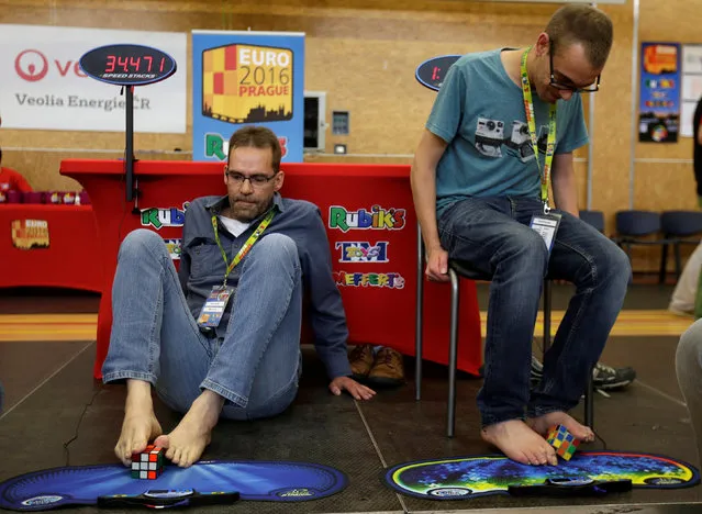Competitors solve Rubik's cubes using their feet during the Rubik's Cube European Championship in Prague, Czech Republic, July 15, 2016. (Photo by David W. Cerny/Reuters)