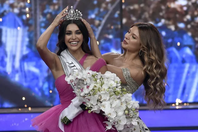 Miss Lebanon 2018 Maya Reaidy (R) puts the crown on the head of Lebanese Yasmina Zaytoun (L) after being crowned Miss Lebanon 2022, during the beauty pageant held at Forum De Beirut in Beirut, Lebanon, 24 July 2022. (Photo by Wael Hamzeh/EPA/EFE)
