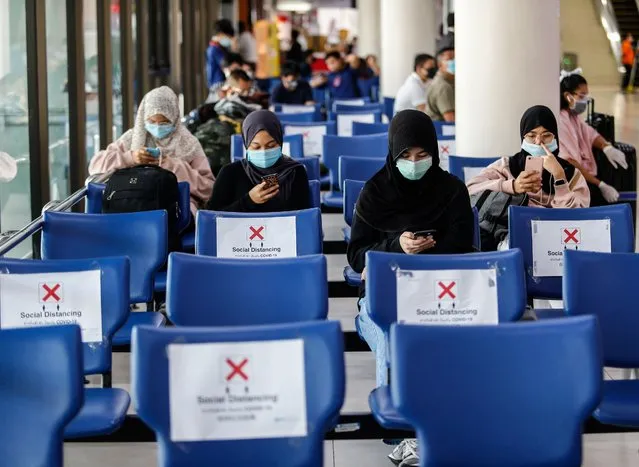 Passengers wearing face masks as a preventive measure at Don Muang International Airport during the Coronavirus (COVID-19) crisis. Thai AirAsia and Thai Lion Air resumed flights on domestic routes after flying was temporarily halted due to the Covid-19 outbreak. (Photo by Chaiwat Subprasom/SOPA Images/LightRocket via Getty Images)