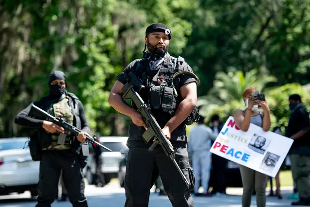 Members of the Black Panther Party, “I Fight For My People”, and “My Vote is Hip Hop” demonstrate in the Satilla Shores neighborhood on May 9, 2020 where Ahmaud Arbery was shot and killed in Brunswick, Georgia. Arbery, a black man, was killed by two white men, a former police officer and his son, while jogging in the neighborhood on February 23. (Photo by Sean Rayford/Getty Images)