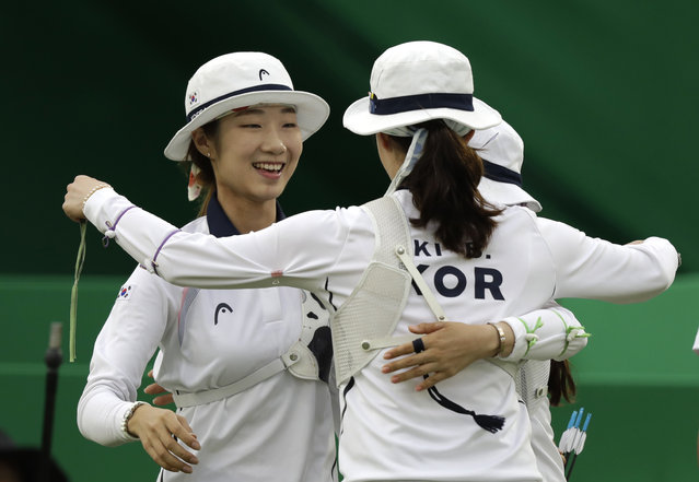 South Korea's Choi Mi-sun celebrates with her teammates during the women's team archery competition at the Sambadrome venue during the 2016 Summer Olympics in Rio de Janeiro, Brazil, Sunday, August 7, 2016. (Photo by Natacha Pisarenko/AP Photo)