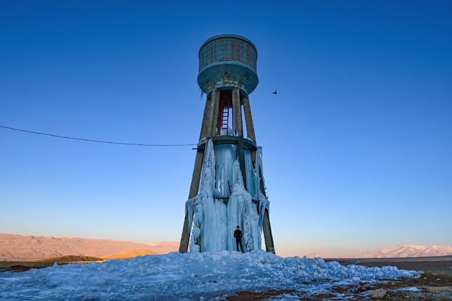 A view of the elevated tank, covered with icicles formed by the freezing of water flowing from bursted pipes due to extreme cold, in Gevas district of Van, Turkiye on January 30, 2025. (Photo by Ozkan Bilgin/Anadolu via Getty Images)