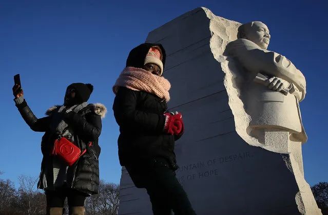 Saoudatou Dia (L) and her daughter Aminah (R) visit the Martin Luther King Jr. Memorial on Martin Luther King Day January 15, 2018 in Washington DC. Martin Luther King Jr. would have been 89 years old today. (Photo by Win McNamee/Getty Images)