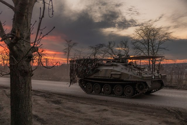 A Ukrainian serviceman drives a British FV103 Spartan armoured personnel carrier on a road that leads to the town of Chasiv Yar, in the Donetsk region, on March 30, 2024, amid the Russian invasion of Ukraine. Ukrainian forces face a “difficult” situation around the eastern city of Chas?v Yar as Russia focuses its offensive there, a Ukrainian army official said on March 25, 2024. (Photo by Roman Pilipey/AFP Photo)