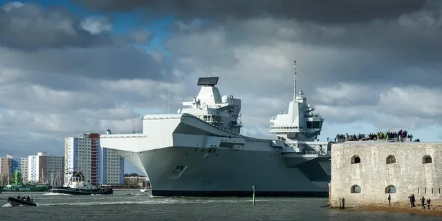 A handout photo made available by th British Ministry of Defence (MOD) showing the UK's new aircraft carrier, HMS Queen Elizabeth, sailing from her home in Portsmouth for the first time since being officially commissioned into the Royal Navy in December, in Portsmouth, Britain, 02 February 2018. According to the MOD, the 65,000 tonne vessel will spend the next month conducting further testing. (Photo by Keith Morgan/EPA/EFE/British Ministry of Defence)