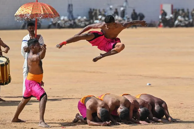 Madras Engineers Group (MEG) soldiers perform 'Kalaripayattu', a traditional martial art from Kerala, during celebrations for the India's 74th Republic Day in Bengaluru on January 26, 2023. (Photo by Manjunath Kiran/AFP Photo)