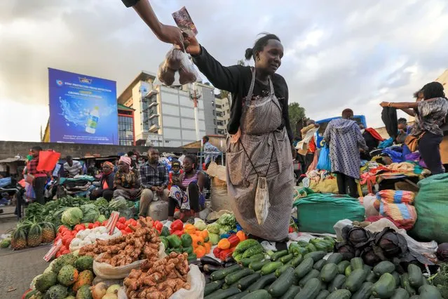 A vegetable vendorsells ginger, garlic, and lime among other organic vegetables being used as immune boosters that most Kenyans hope that it can ward off the COVID-19 disease, at a local restaurant in Nairobi, Kenya, 26 August 2020. In recent months, there has been an increase in demand for the Dawa drinks, making their prices to shoot upwards significantly. Most vegetable sellers have turned to selling Dawa ingredients because of the current demand. (Photo by Daniel Irungu/EPA/EFE/Rex Features/Shutterstock)