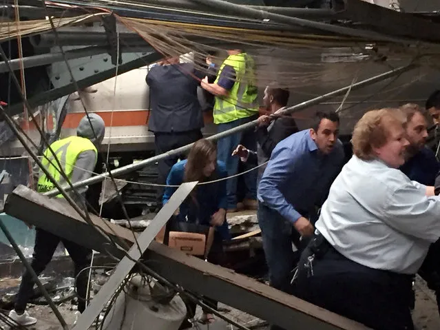 Passengers rush to safety after a NJ Transit train crashed in to the platform at the Hoboken Terminal September 29, 2016 in Hoboken, New Jersey. (Photo by Pancho Bernasconi/Getty Images)