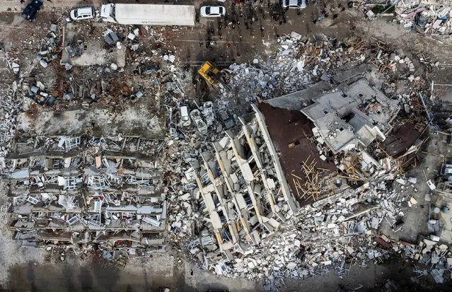 A photo taken with a drone shows a an aerial view over collapsed buildings after an earthquake in Hatay, Turkey, 07 February 2023. Thousands of people died and thousands more were injured after major earthquakes struck southern Turkey and northern Syria on 06 February. Authorities fear the death toll will keep climbing as rescuers look for survivors across the region. (Photo by Erdem Sahin/EPA/EFE/Rex Features/Shutterstock)