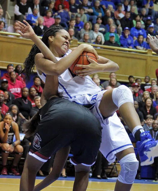 Duke's Azura Stevens grabs a rebound from South Carolina's Tina Roy during an NCAA college basketball game in Durham, N.C., Sunday, December 7, 2014. (Photo by Ted Richardson/AP Photo)