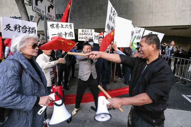 A supporter of Taiwan, right, confronts protesters opposed to Taiwanese independence outside a hotel where Taiwanese President Tsai Ing-wen is expected to arrive in Los Angeles, Tuesday, April 4, 2023. (Photo by Ringo H.W. Chiu/AP Photo)