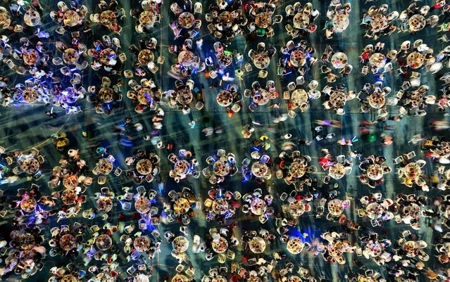 This aerial photo taken on June 13, 2023 shows people eating crayfish during an international crayfish festival in Xuyi County, Huaian city, in China's eastern Jiangsu province. (Photo by AFP Photo/China Stringer Network)
