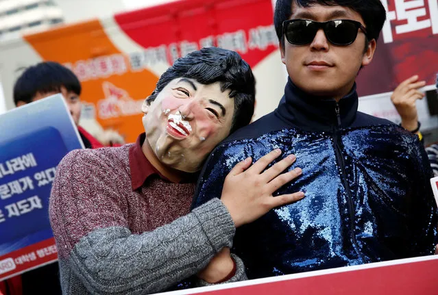 A man wearing a mask depicting South Korean President Park Geun-hye attends a protest calling Park to step down, in Seoul, South Korea, November 19, 2016. (Photo by Kim Hong-Ji/Reuters)