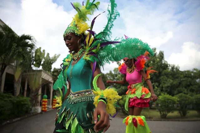 Dancers in traditional costumes depart after Prince Harry attended a charity event during his official visit in St. John's, Antigua November 21, 2016. (Photo by Carlo Allegri/Reuters)