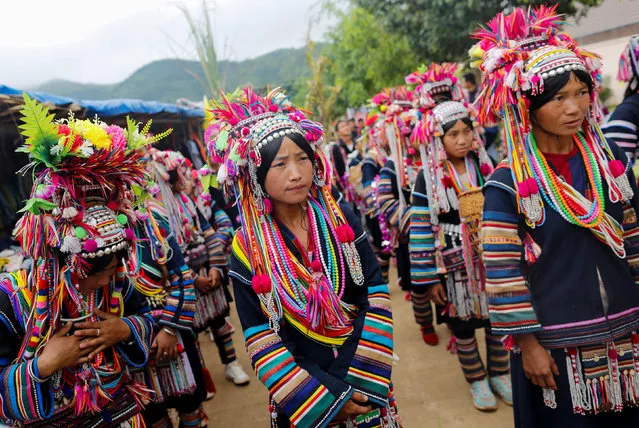 Ethnic Akha women march during a festival in a village outside Pansang, Wa territory in northeast Myanmar October 3, 2016. (Photo by Soe Zeya Tun/Reuters)