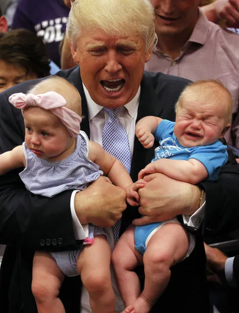 Republican presidential nominee Donald Trump reacts to the cries of three-month-old Kellen Campbell, of Denver, right, while holding six-month-old Evelyn Keane, of Castel Rock, Colo., after Trump's speech at the Gallogly Event Center on the campus of the University of Colorado on July 29, 2016 in Colorado Springs, Colorado. (Photo by Joe Mahoney/Getty Images)