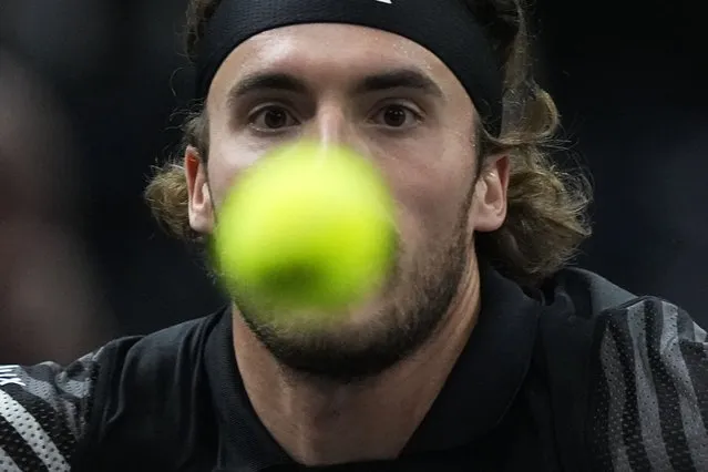 Greece's Stefanos Tsitsipas eyes the ball as he plays Germany's Alexander Zverev during their third round match of the Paris Masters tennis tournament, at the Accor Arena, Thursday November 2, 2023 in Paris. (Photo by Michel Euler/AP Photo)