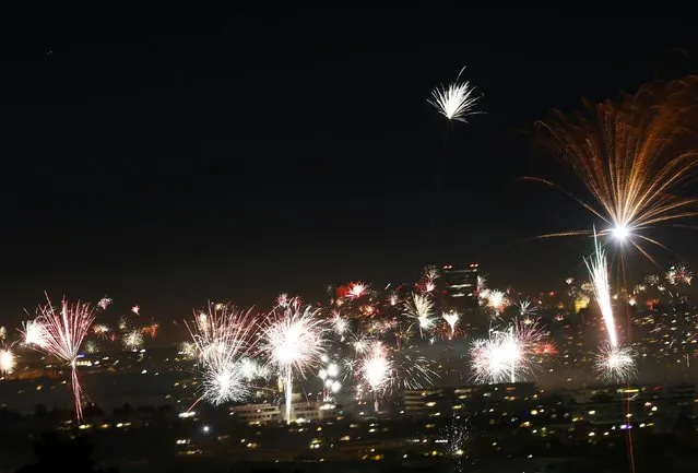 Fireworks explode over Vienna's skyline during New Year celebration in Vienna, Austria, January 1, 2017. (Photo by Leonhard Foeger/Reuters)