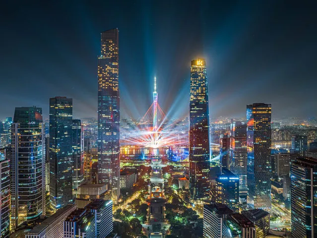 The Canton Tower and skyscrapers are illuminated during a rehearsal for the 2023 Guangzhou International Light Festival on November 20, 2023 in Guangzhou, Guangdong Province of China. The 12th Guangzhou International Light Festival will be held from November 21 to 30. (Photo by Wu Wenjun/VCG via Getty Images)
