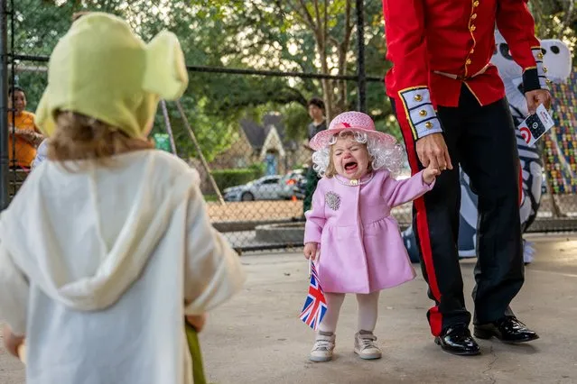 Madeline Evans begins to cry after winning a costume contest at the Proctor Plaza Community Center on October 31, 2022 in Houston, Texas. Community members and families all over Houston came out to celebrate Halloween together. (Photo by Brandon Bell/Getty Images)