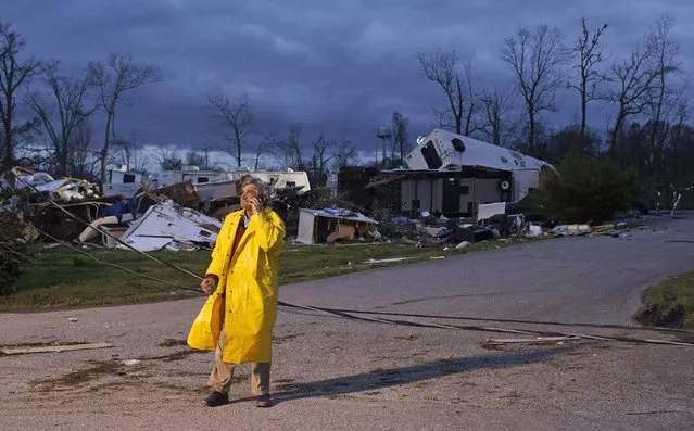 Director of Emergency Operations for St. James Parish Blaise Gravois talks on the phone at Sugar Hill RV Park following a storm in Convent, La., February 24, 2016. Tornadoes and severe weather ripped through the Gulf Coast on Tuesday, mangling trailers at an RV park and ripping off roofs from buildings in Louisiana and Mississippi, authorities said. (Photo by Max Becherer/AP Photo)