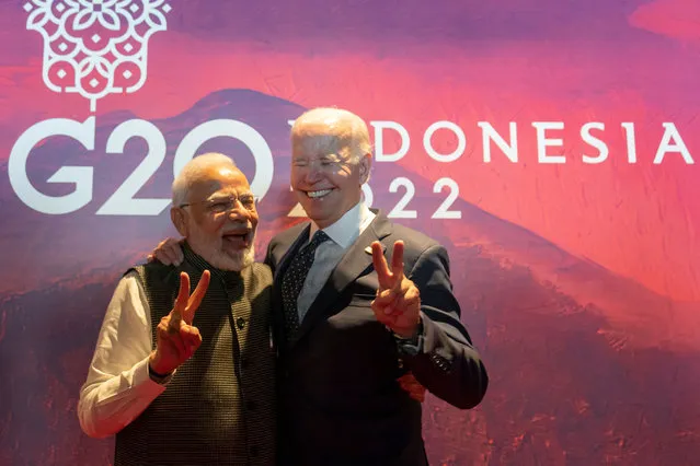 President Joe Biden (R) gestures with India's Prime Minister Narendra Modi before the Partnership for Global Infrastructure and Investment meeting at the G20 Summit in Nusa Dua on the Indonesian resort island of Bali on November 15, 2022. (Photo by Alex Brandon/Pool via AFP Photo)