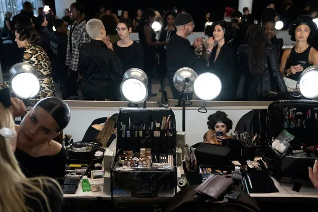 Models are prepped backstage before presenting creations by Sergio Hudson, during New York Fashion Week, in New York City, New York, U.S., February 12, 2024. (Photo by David Dee Delgado/Reuters)