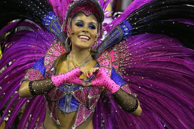 A performer from the Sao Clemente samba school parades through the Sambadrome for carnival in Rio de Janeiro, Brazil, Monday, March 3, 2014. (Photo by Nelson Antoine/AP Photo)