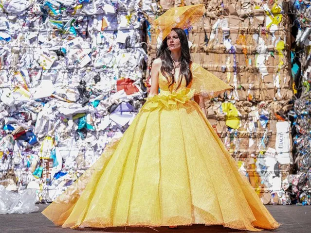 A model dressed in clothes made of waste products such as plastic bags, plaster nets, rope, paper and calendar leaves poses for a photo at a recycling facility in Diyarbakir, Turkiye on March 25, 2024. (Photo by Bestami Bodruk/Anadolu via Getty Images)