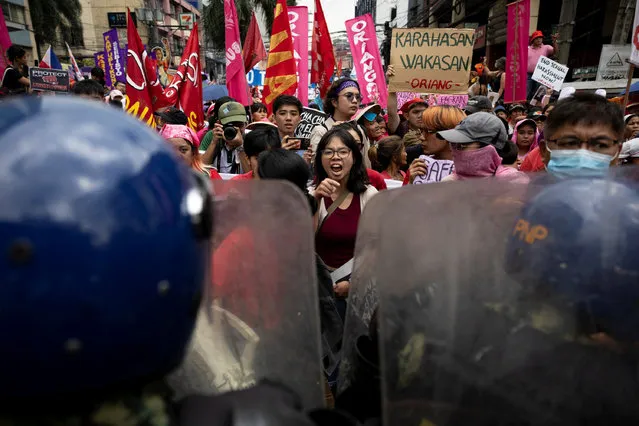 A Filipina activist yells as police block a protest march from proceeding in Manila, Philippines on March 8, 2024. (Photo by Eloisa Lopez/Reuters)