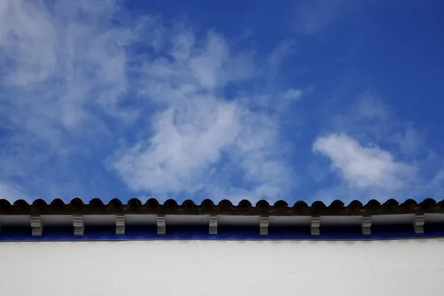 A house painted in the traditional indigo and white Manchegan style is partially seen in Alcazar de San Juan, Spain, April 5, 2016. (Photo by Susana Vera/Reuters)