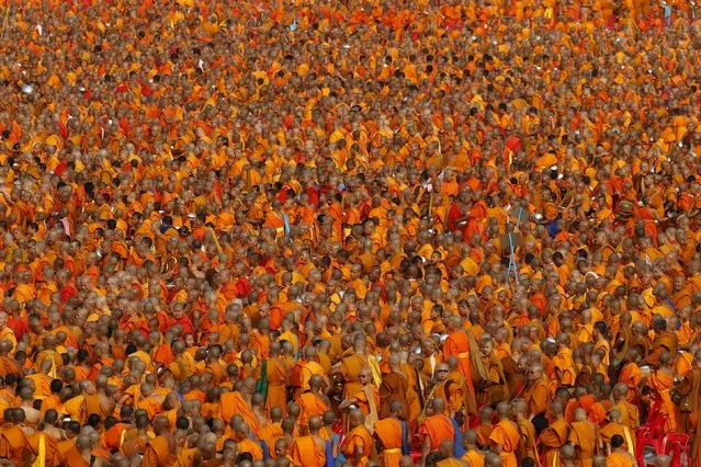 Over 100,000 Buddhist monks and novices gather to receive alms at Wat Phra Dhammakaya temple in Pathum Thani, outside Bangkok April 22, 2016. (Photo by Jorge Silva/Reuters)