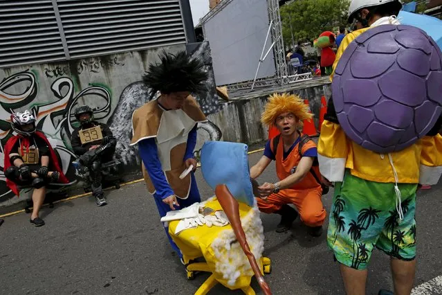 Competitors dressed up as characters from Japanese comic book series “Dragon Ball” take part in the office chair race ISU-1 Grand Prix in Tainan, southern Taiwan April 24, 2016. (Photo by Tyrone Siu/Reuters)