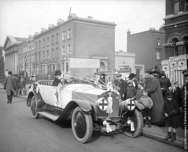 Mr W Weekes drives a Rolls Royce decorated with slogans promoting 'Our Day', which collects fund to help soldiers at the front during World War I, 1916