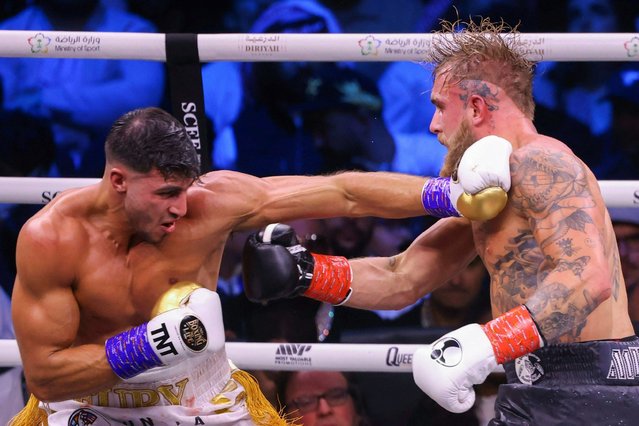 British reality TV star Tommy Fury (L) fights against US YouTuber Jake Paul during a boxing match held at Diriyah in Riyadh on February 27, 2023. (Photo by Fayez Nureldine/AFP Photo)