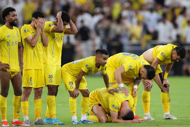 Nassr's players react in the penalty shootout during the King's Cup final match between Al-Nassr and Al-Hilal at the King Abdullah Sport City Stadium in Jeddah on May 31, 2024. (Photo by AFP Photo)