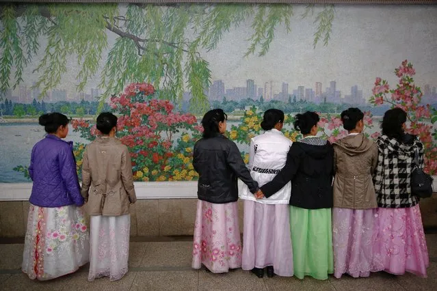 Women wearing traditional clothes wait for the train inside a subway station in central Pyongyang, North Korea May 7, 2016. (Photo by Damir Sagolj/Reuters)
